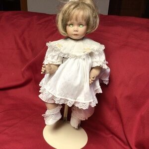 Porcelain doll with stand